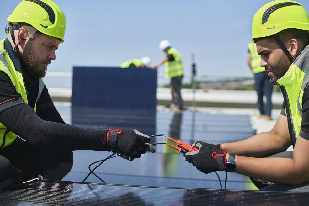 Technicians miniting a solar panel