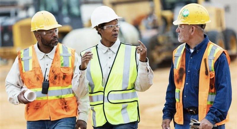 workers on construction site in safety gear