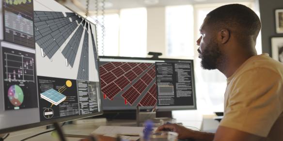student working working on software of a solar panel array