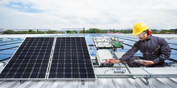 Technician repairing solar panel